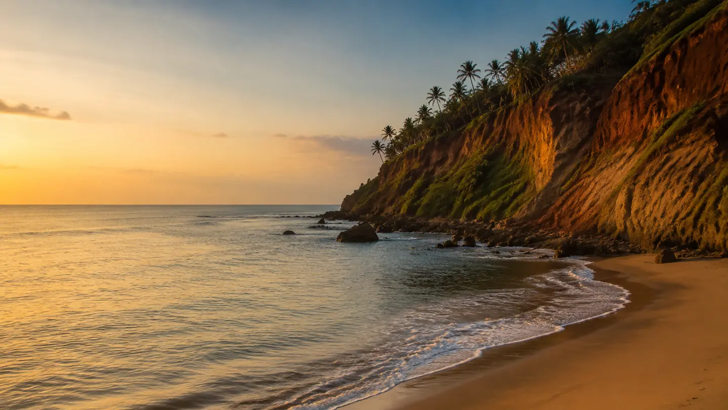 Warm sunset over Kerala's cliff-lined coast